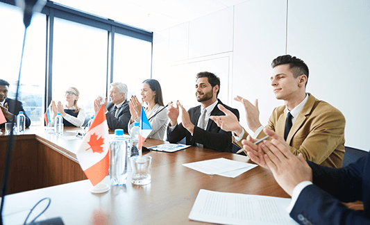 politicians-applauding-at-meeting